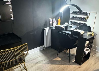 Modern nail station at By Ellie Rose in Brightons, Scotland, GB, featuring sleek design and ambient lighting.