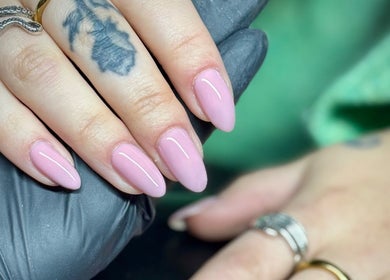 Stylish pink manicure at By Ellie Rose, Brightons, Scotland, GB. Trendy nail art with detailed tattoo.