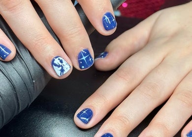 Blue galaxy nail art at By Ellie Rose in Brightons, Scotland, GB highlighting intricate cosmic designs.