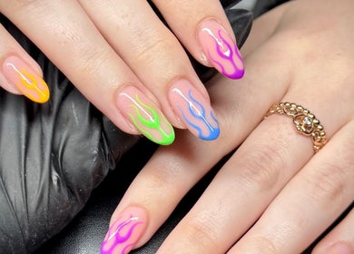 Colorful flame nail art by Ellie Rose in Brightons, Scotland, GB, showcasing intricate design craftsmanship.