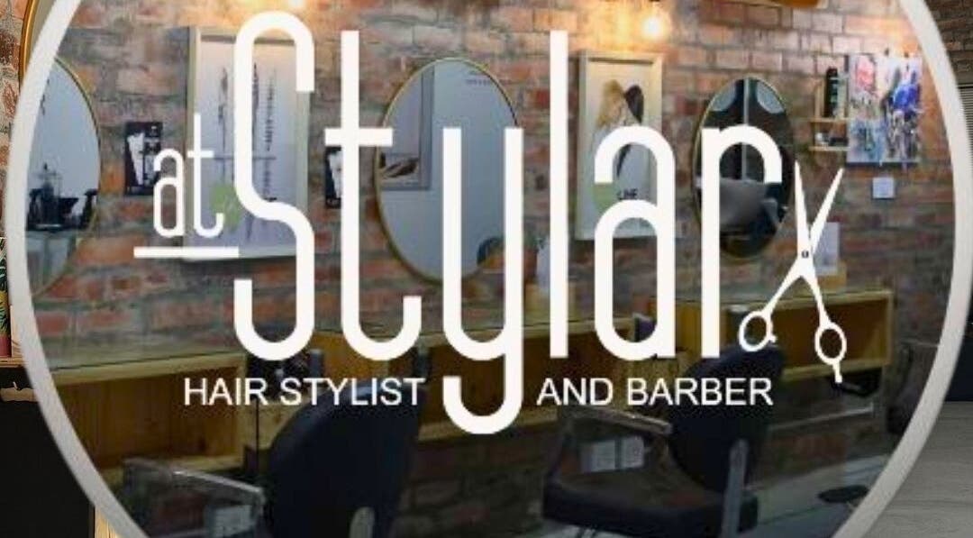 Interior of At Stylar (Pty) Ltd, a stylish hair salon in Cape Town, Western Cape, ZA with modern decor and styling chairs.