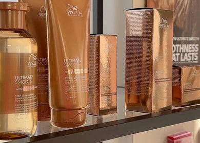 Wella Ultimate Smooth products on shelf at Hairology Rushden, Rushden, England, GB, enhancing hair shine.