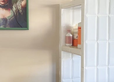 Elegant wall art and shelf at Hairology Rushden, Rushden, England, GB enhancing a serene atmosphere.