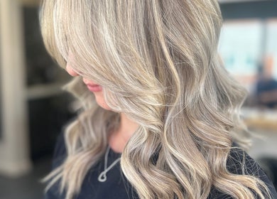 Elegant blonde waves crafted at Hairology Rushden, Rushden, England, GB, showcasing expert hairstyling.