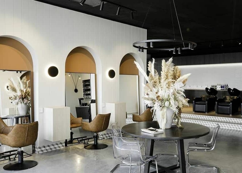 Elegant interior of Unique Artist salon in Gledswood Hills, New South Wales, AU showcasing modern design.