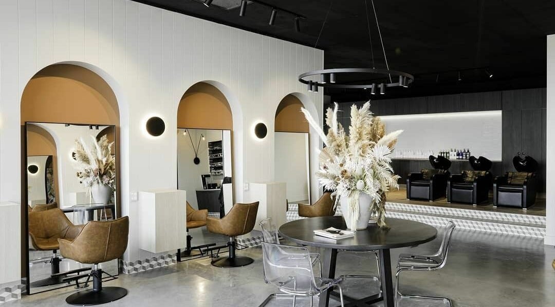 Elegant interior of Unique Artist salon in Gledswood Hills, New South Wales, AU showcasing modern design.