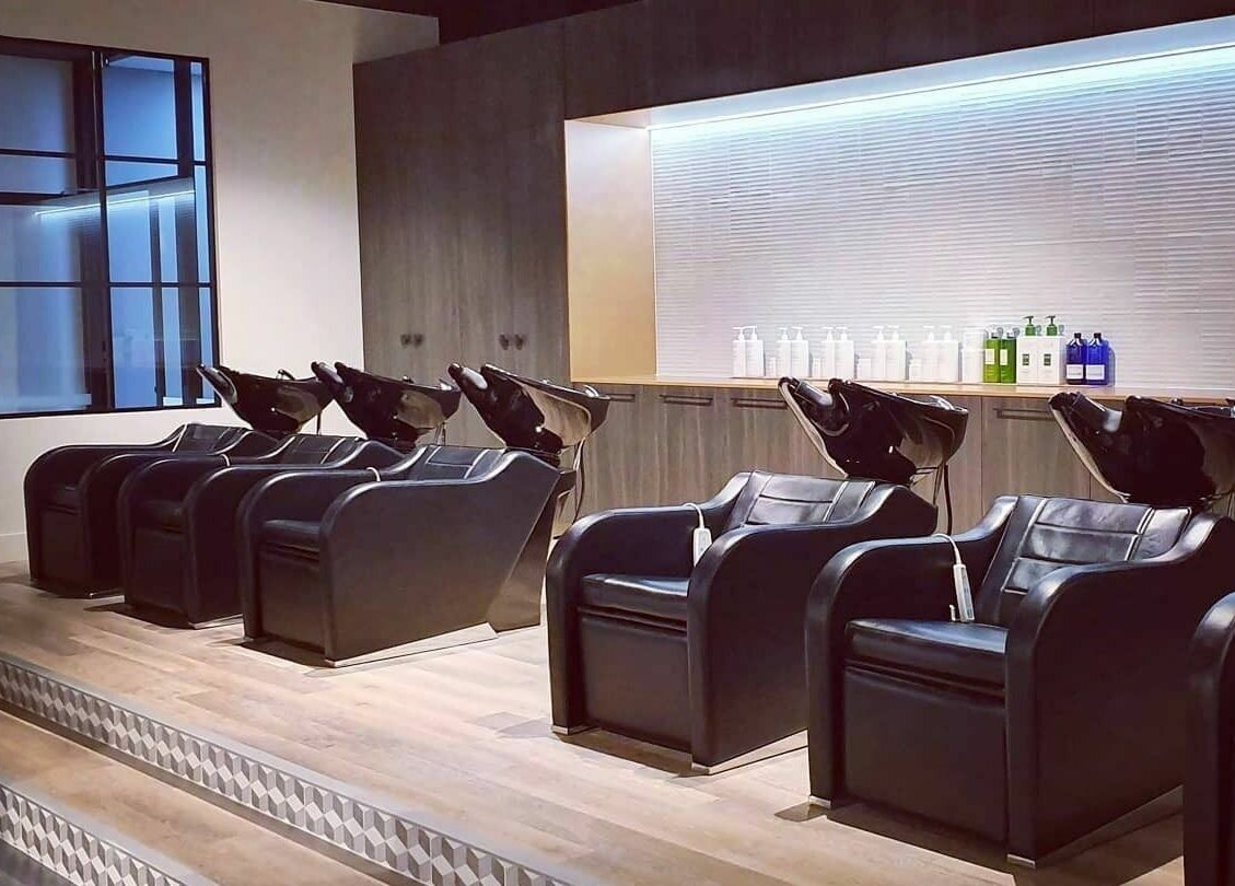 Chic salon wash stations at Unique Artist, Gledswood Hills, New South Wales, AU. Modern styling and comfort.