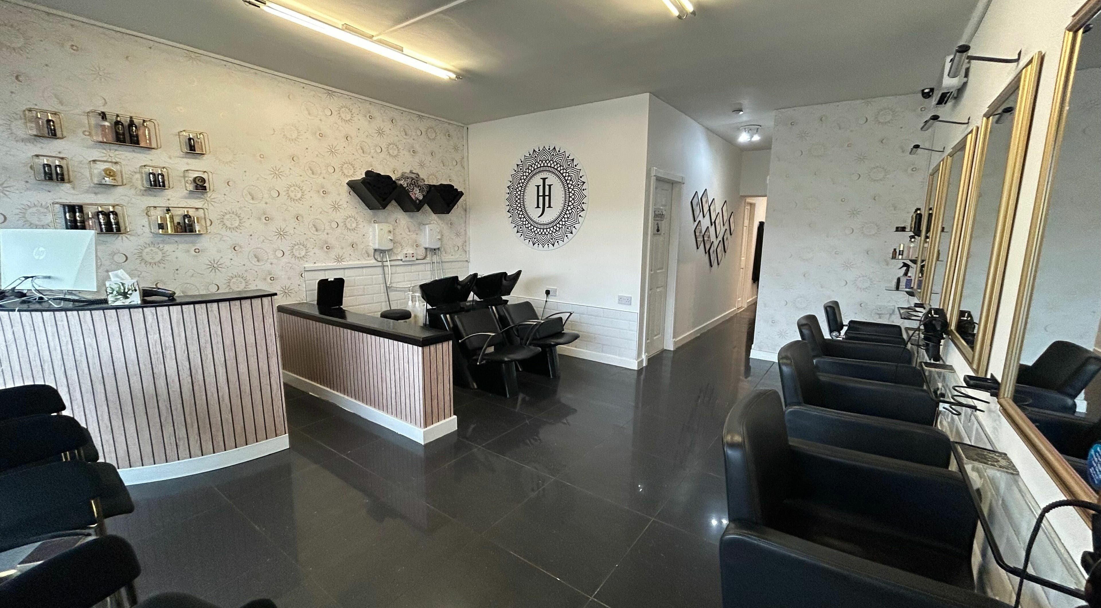 Elegant salon interior at HJ Collective in Heywood, England, GB featuring stylish seating and decor.