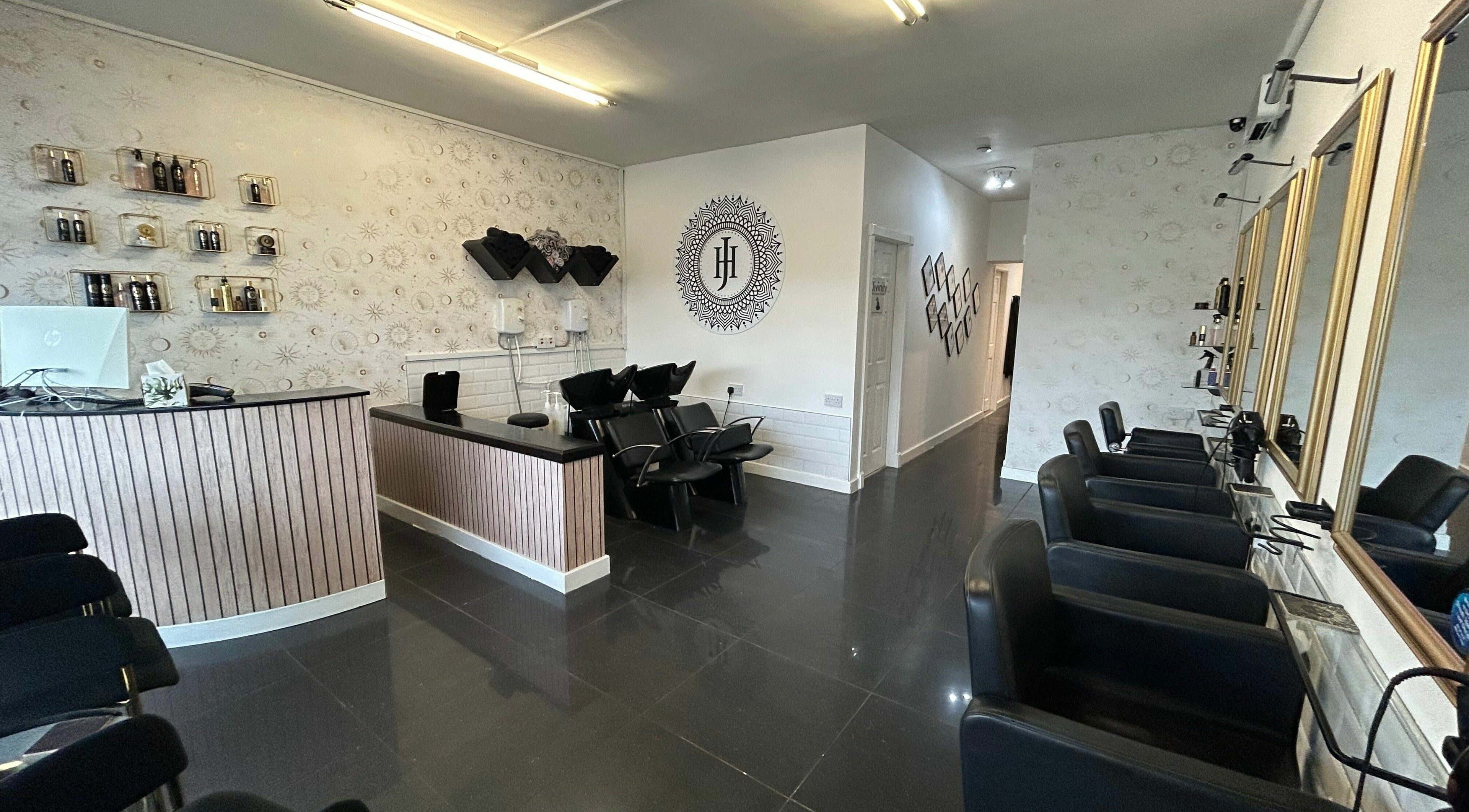 Elegant salon interior at HJ Collective in Heywood, England, GB featuring stylish seating and decor.