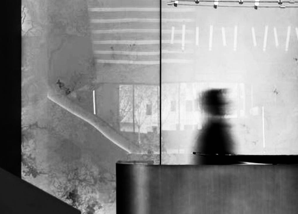 Blurred silhouette behind a modern reception at LDN, Weybridge, England, GB.