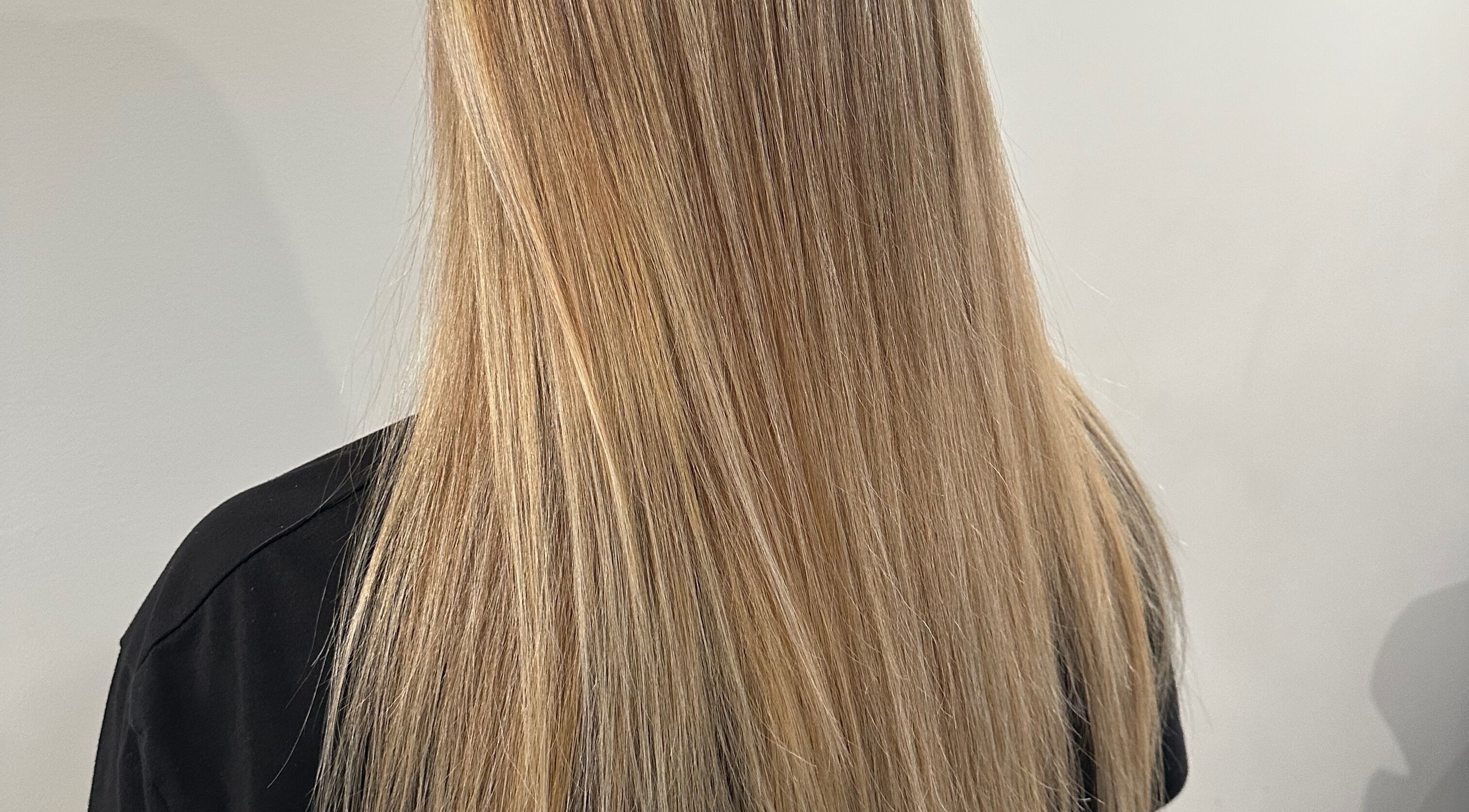 Blonde hair styled at Hill Hair and Makeup in Goderich, Ontario, CA showcasing expert hairstyling.