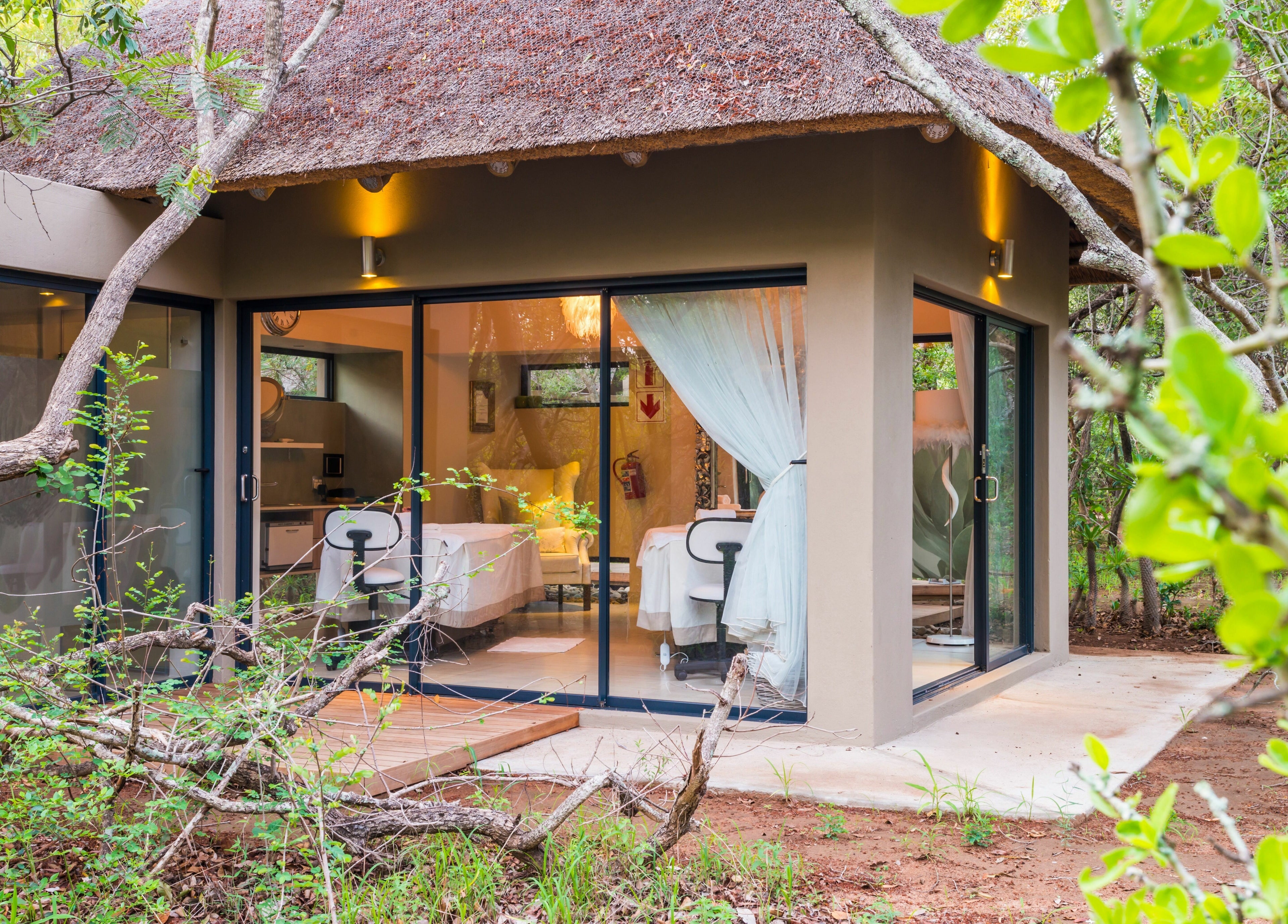 Tranquil treatment room at AM Spa Hoedspruit in Hoedspruit, Limpopo, ZA with lush surroundings.