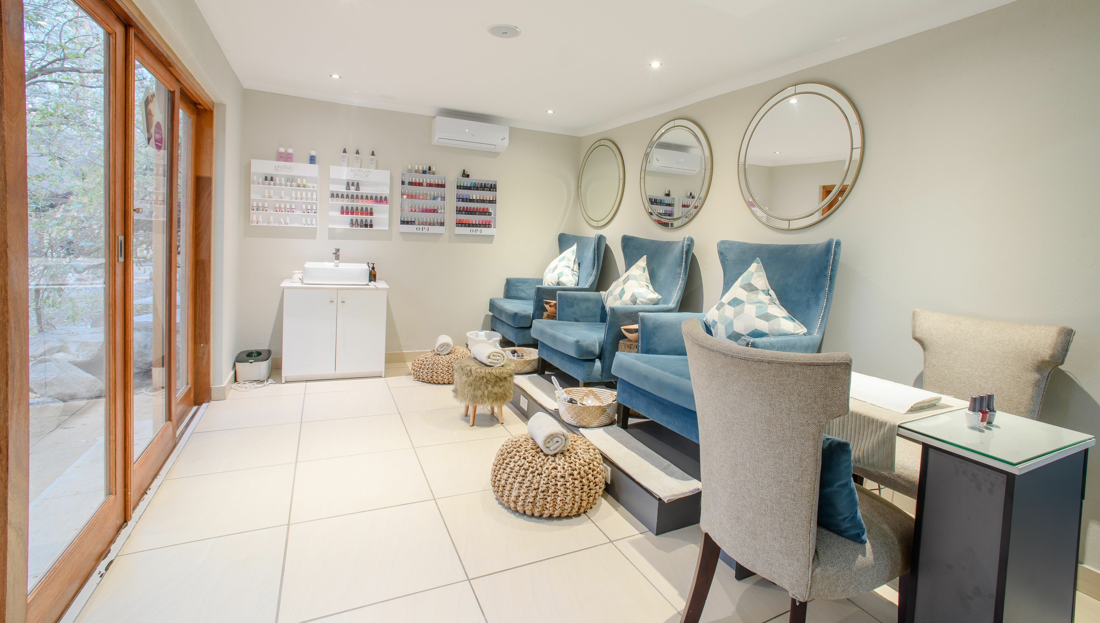 Luxurious pedicure chairs at AM Spa Kruger in Skukuza, Mpumalanga, ZA, offering a serene wellness experience.