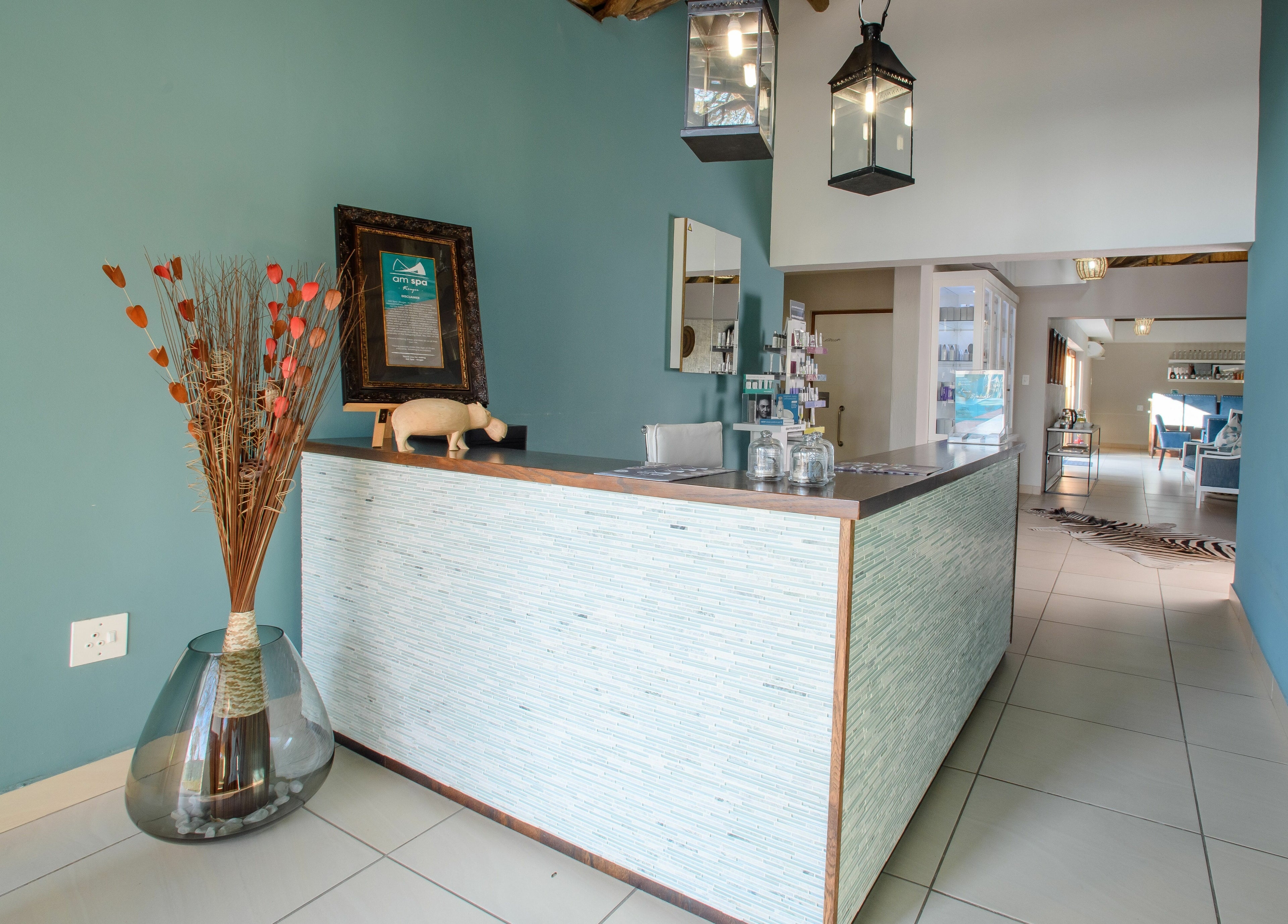 Elegant reception at AM Spa Kruger, Skukuza, Mpumalanga, ZA adorned with chic decor and modern design.