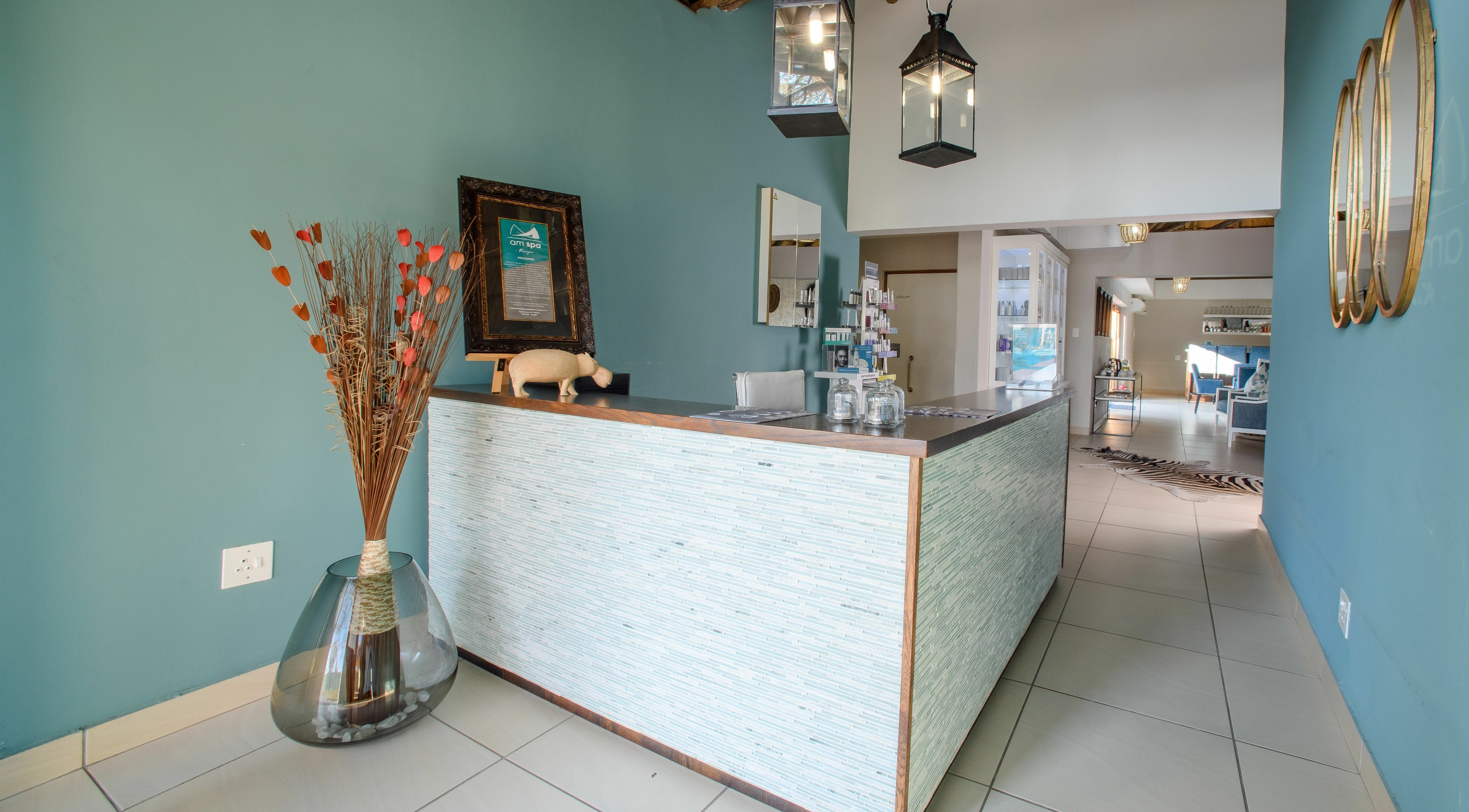 Elegant reception at AM Spa Kruger, Skukuza, Mpumalanga, ZA adorned with chic decor and modern design.