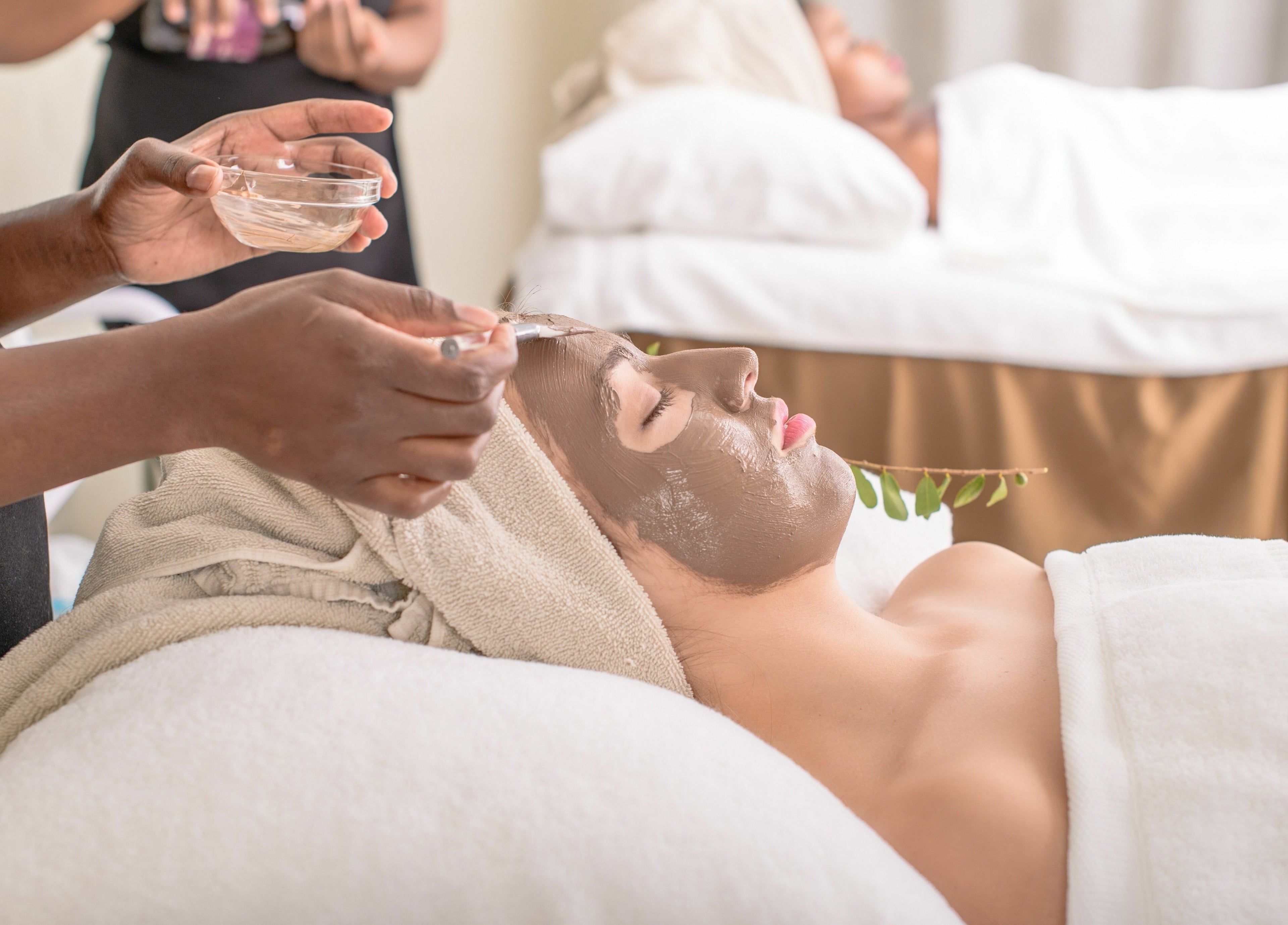 Woman receiving facial treatment at AM Spa Kruger in Skukuza, Mpumalanga, ZA, enhancing relaxation and wellness.