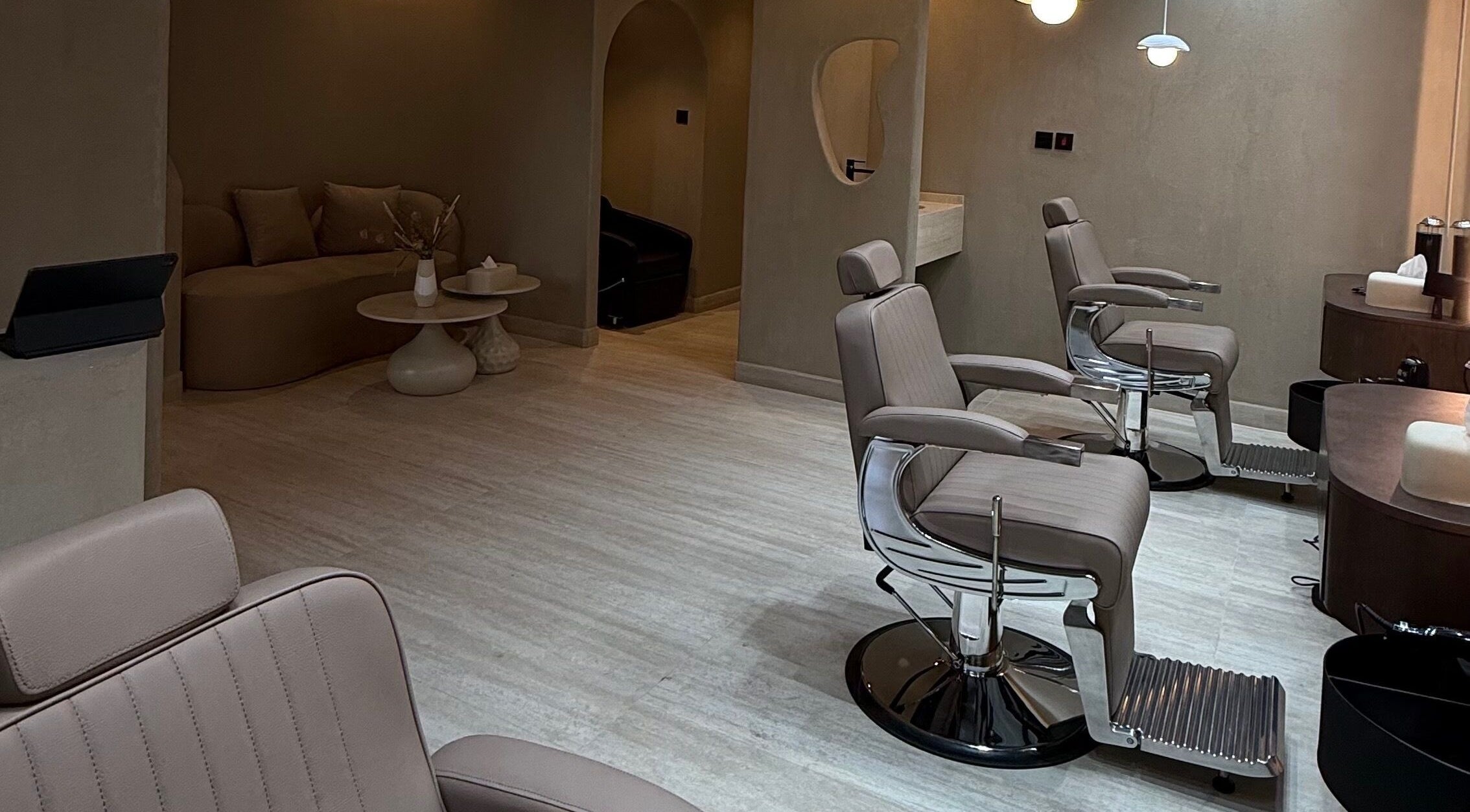 Chic interior of AK Barbershop The Villa in Ras Al-khaimah, Ras Al Khaimah, AE with sleek barber chairs.