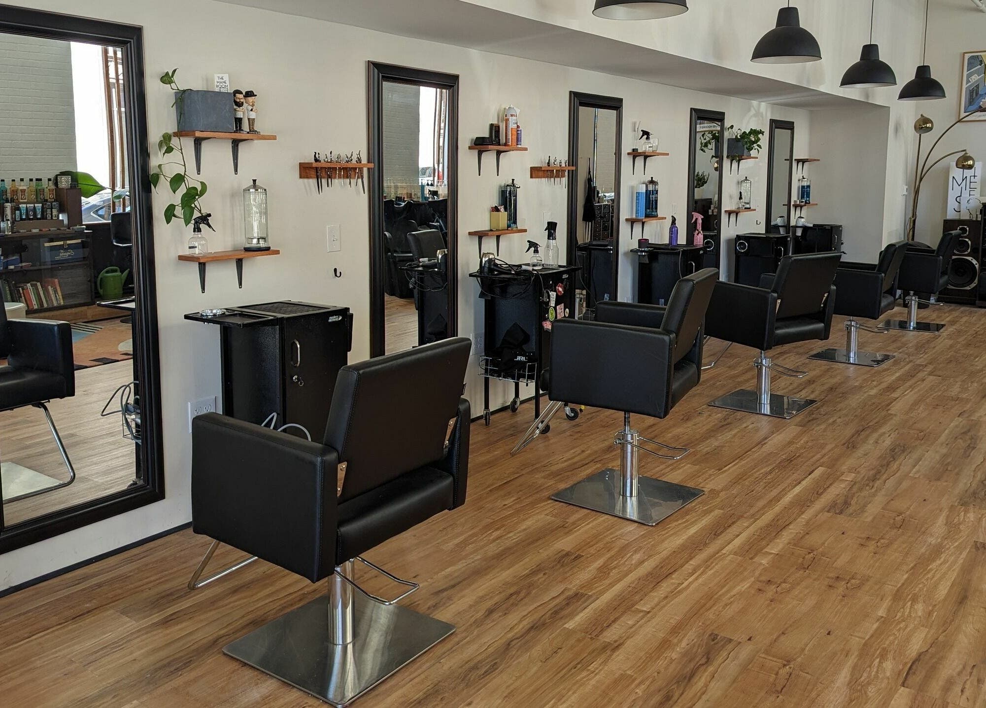 The Mane Room salon interior showcasing stylish chairs and mirrors in Scranton, Pennsylvania, US.