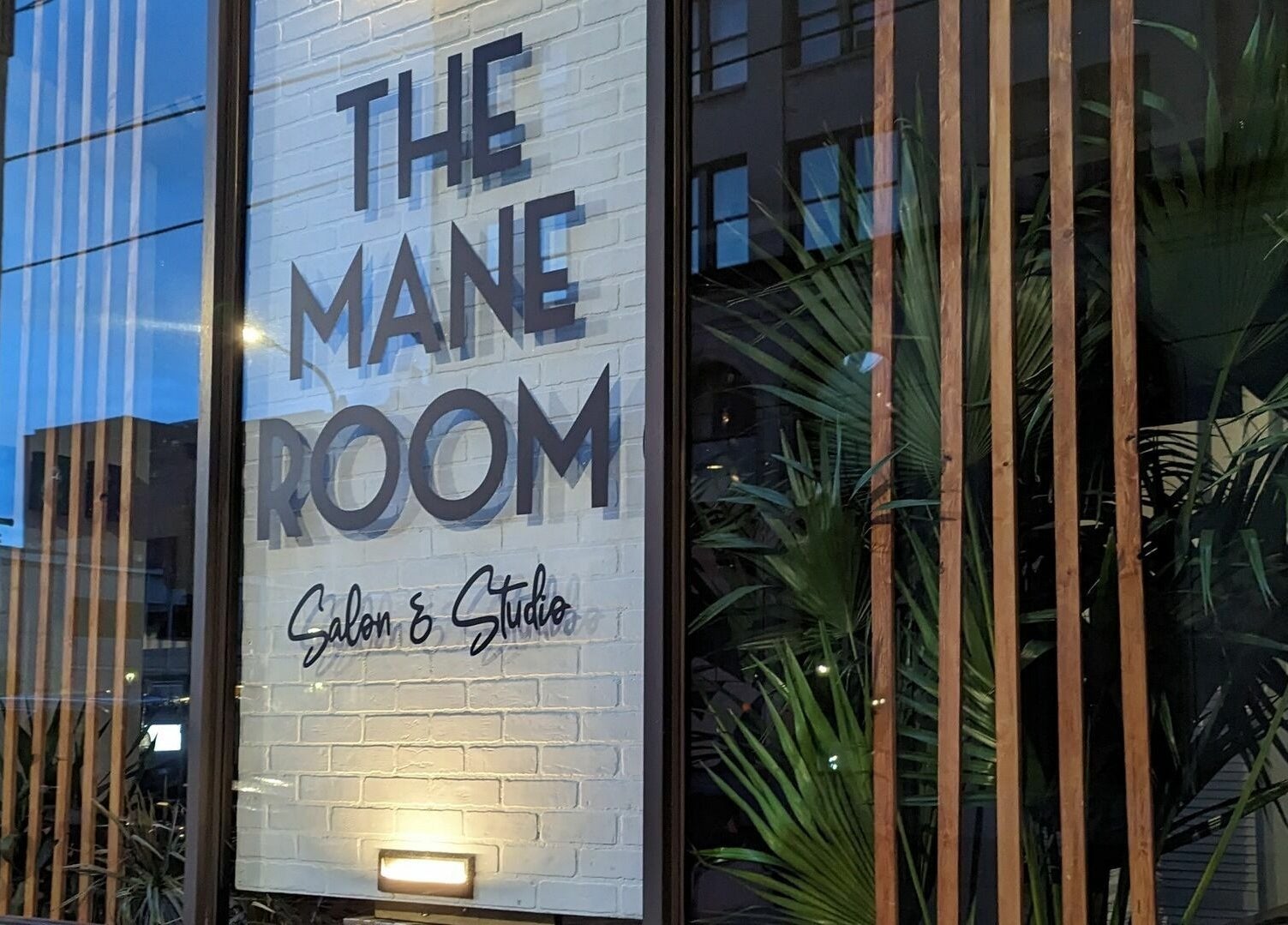 Entrance view of The Mane Room with stylish decor in Scranton, Pennsylvania, US.
