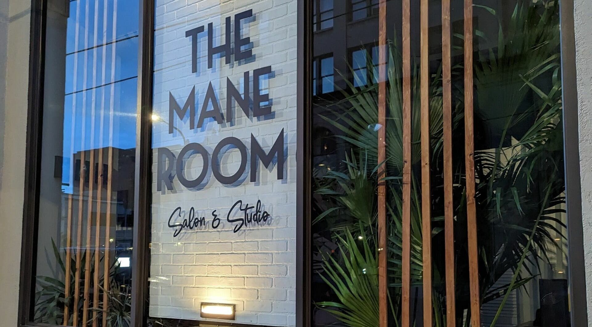 Entrance view of The Mane Room with stylish decor in Scranton, Pennsylvania, US.