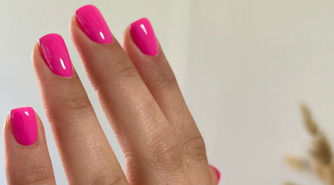 Bright pink manicured nails at The Nail Retreat, Heytesbury, England, GB showcase elegant artistry.
