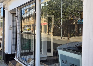 Exterior view of Neil Curry Hairdressing Ltd in Cambridge, England, GB, highlighting the salon’s inviting facade.