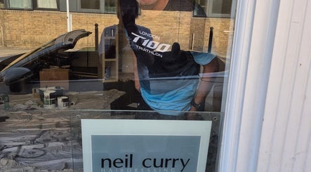 Reflection on Neil Curry Hairdressing Ltd window, Cambridge, England, GB.