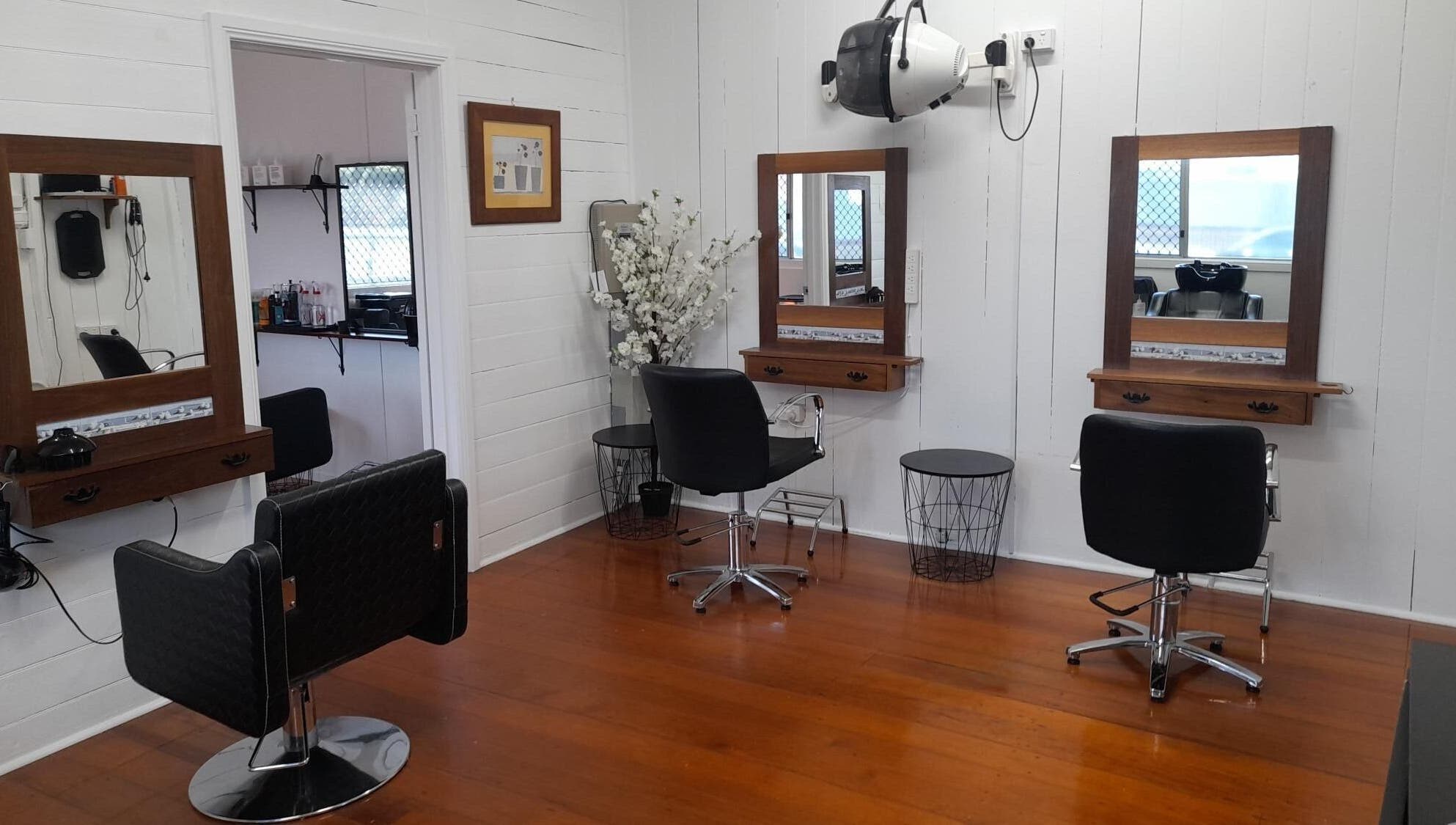 Elegant hair salon setup at Sadie's Hair Shed, Beaudesert, Queensland, AU with stylish chairs and mirrors.