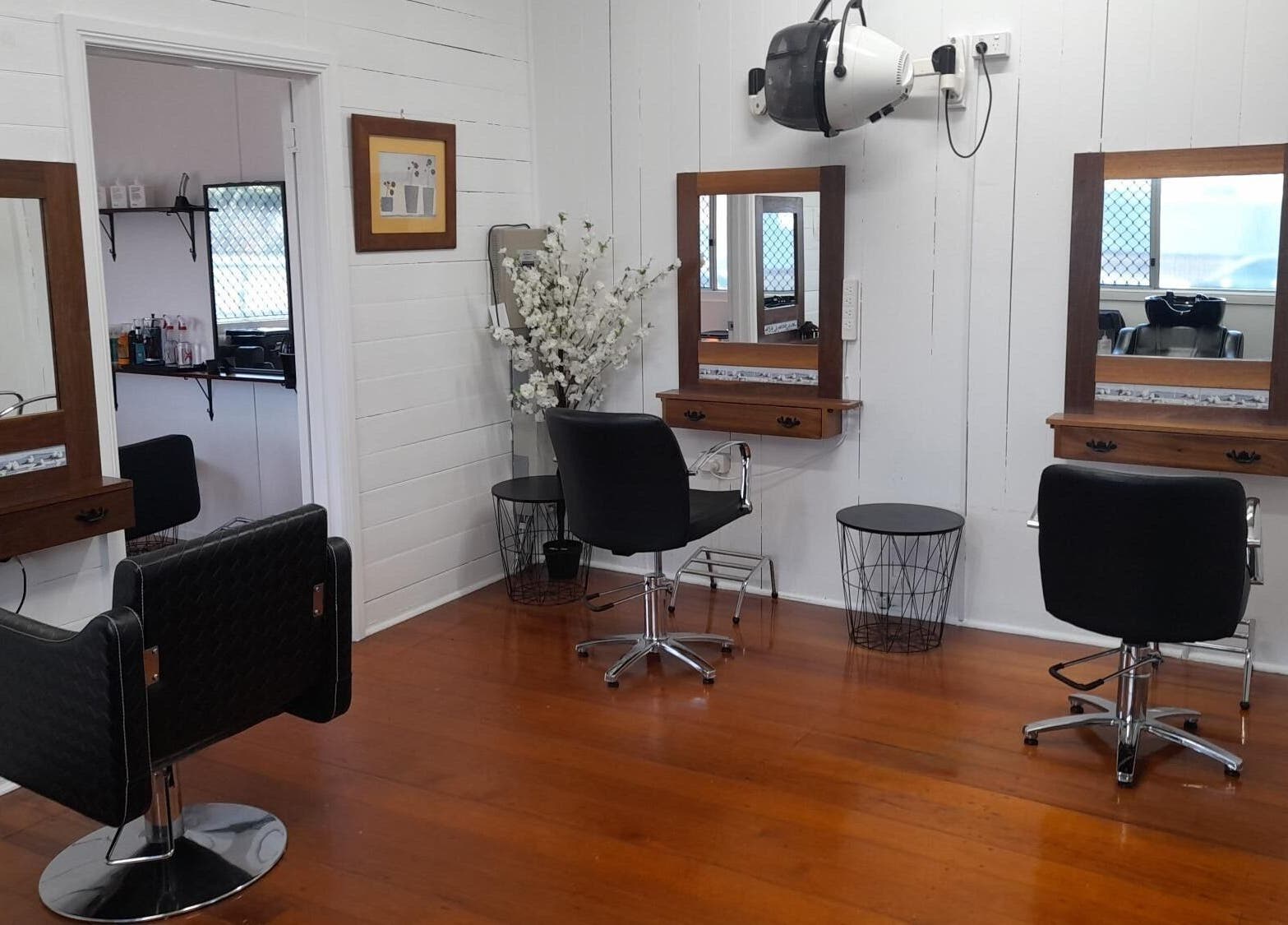 Elegant hair salon setup at Sadie's Hair Shed, Beaudesert, Queensland, AU with stylish chairs and mirrors.