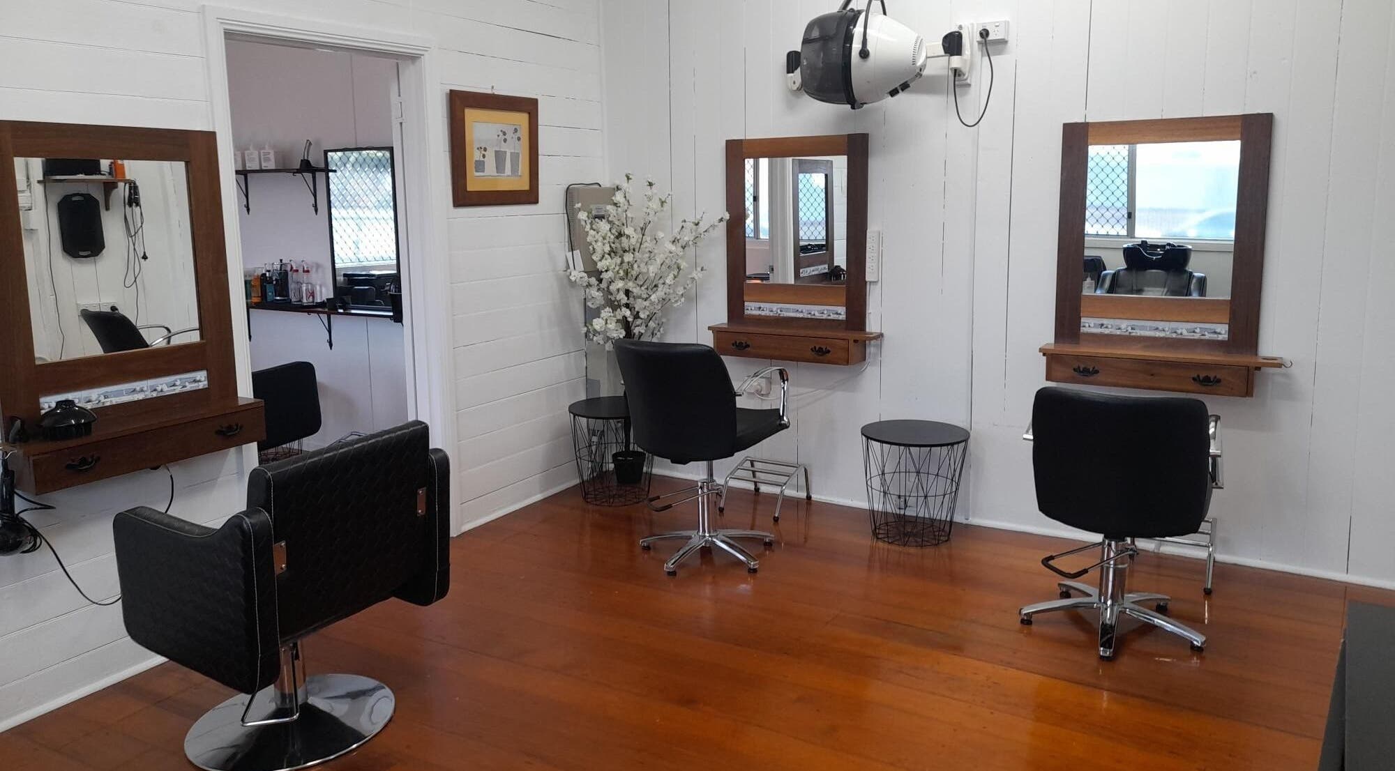 Elegant hair salon setup at Sadie's Hair Shed, Beaudesert, Queensland, AU with stylish chairs and mirrors.