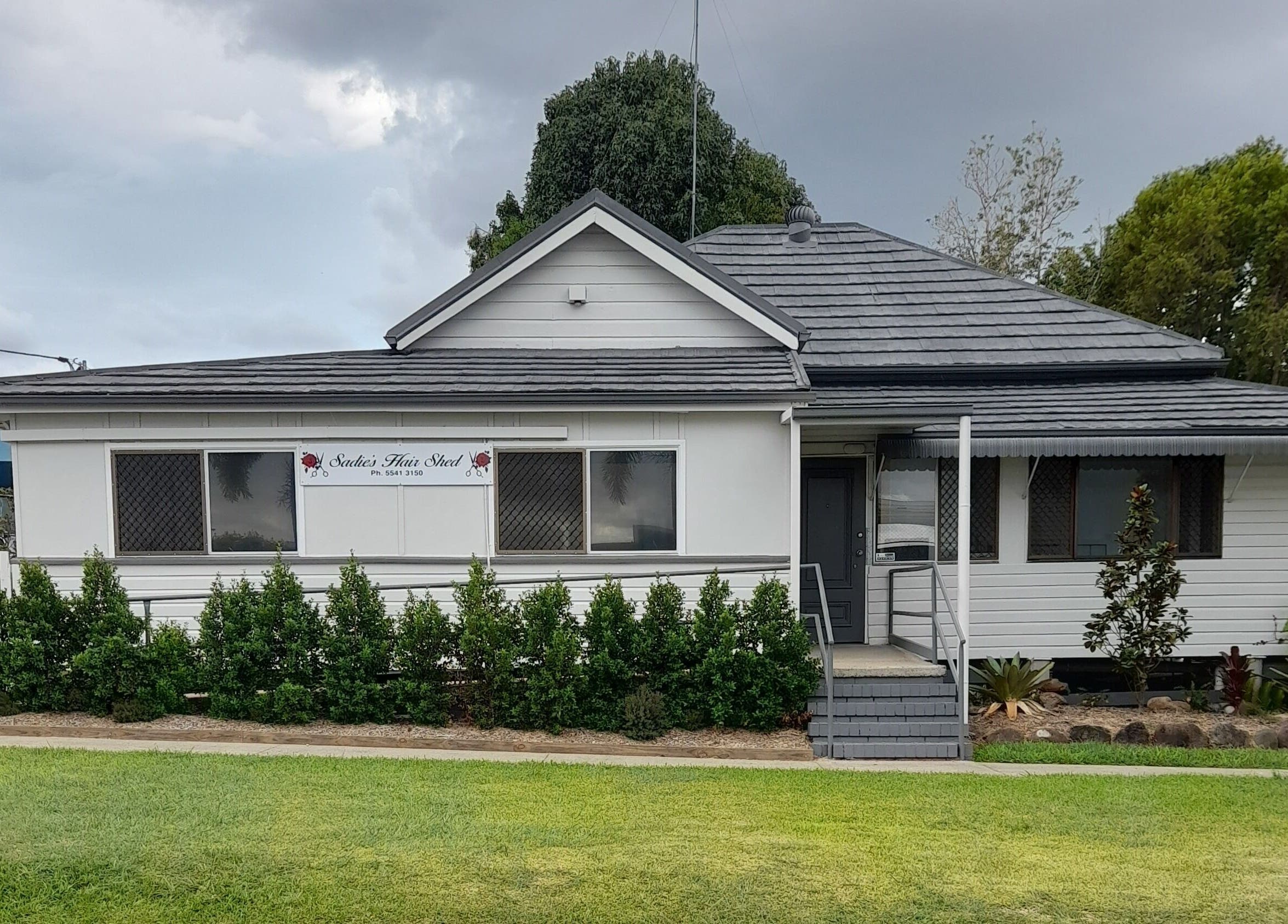 Front view of Sadie's Hair Shed, a quaint white building in Beaudesert, Queensland, AU.