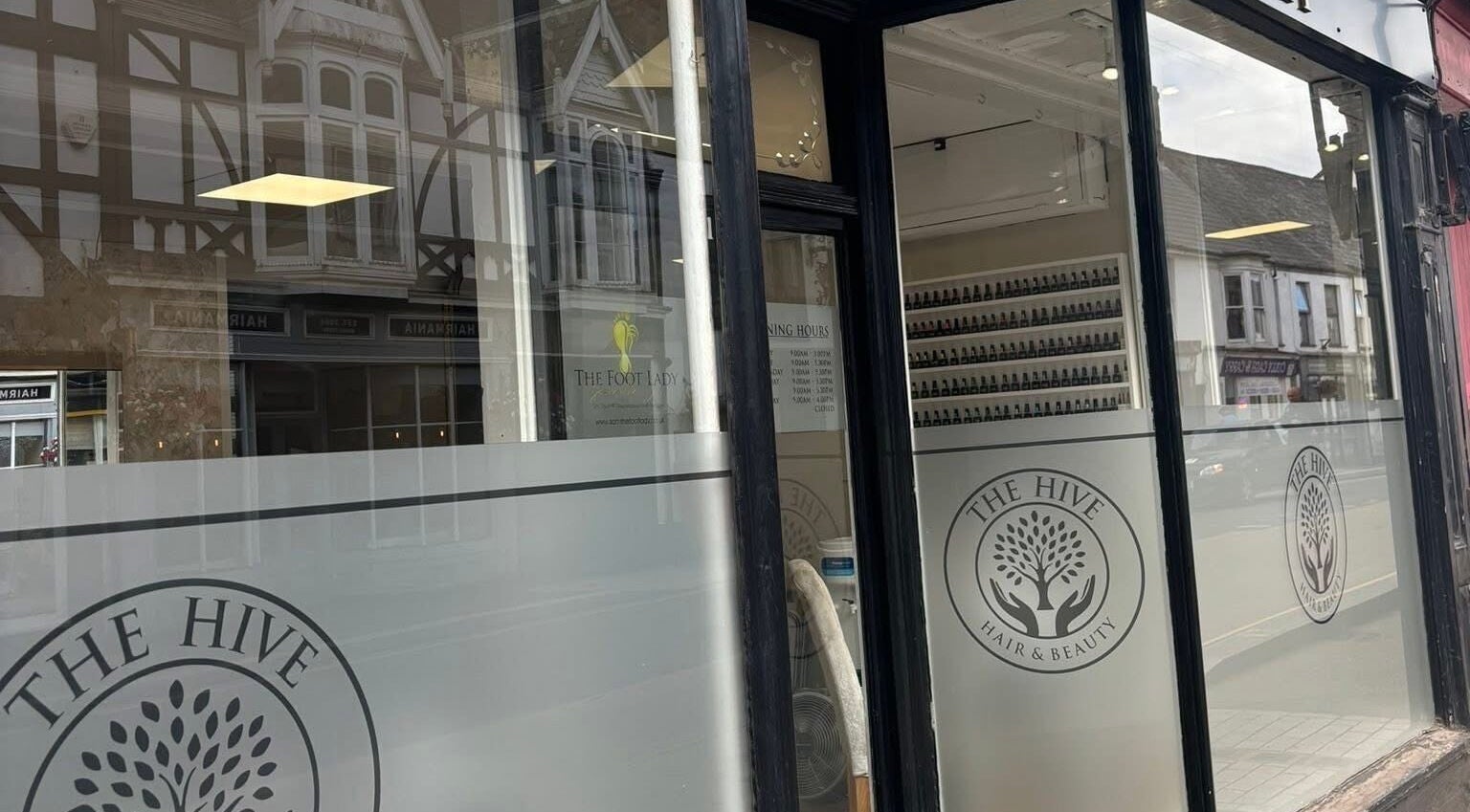 Front entrance of The Hive Beauty, Holistics & Hair, Cullompton, England, GB, showcasing elegant decor.