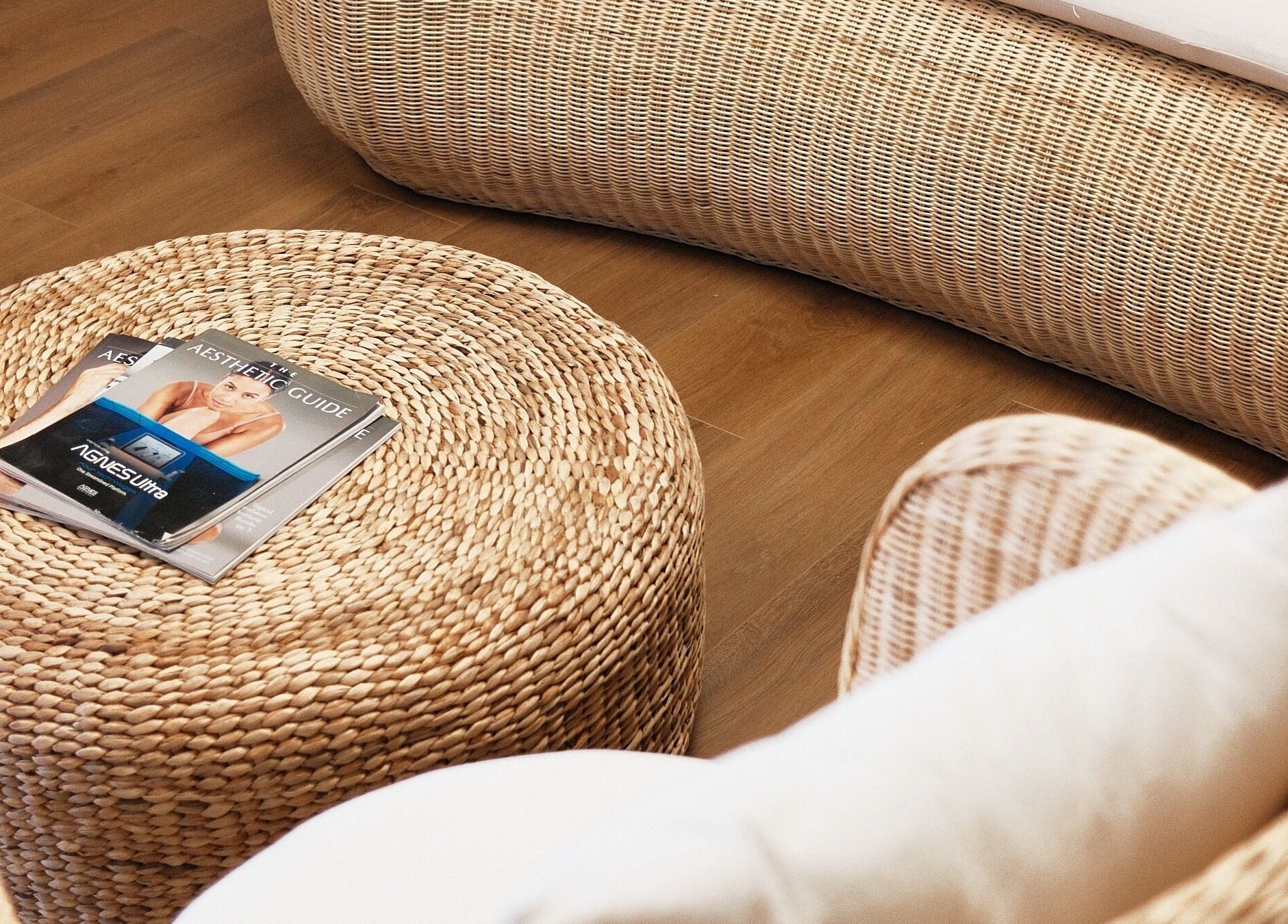 Relaxing lounge with wicker furniture at Enhance Hawaiʻi in Kailua, Hawaii, US offering comfort and calm.