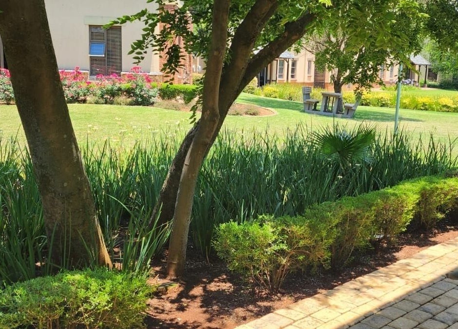 Lush gardens at The Skin Revision Co, Centurion, Gauteng, ZA, offering a serene wellness retreat.