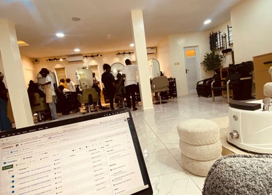 Lively interior at Ignite Beauty and Luxury Salon, Lagos, Lagos, NG, showcasing modern salon setup and clientele.