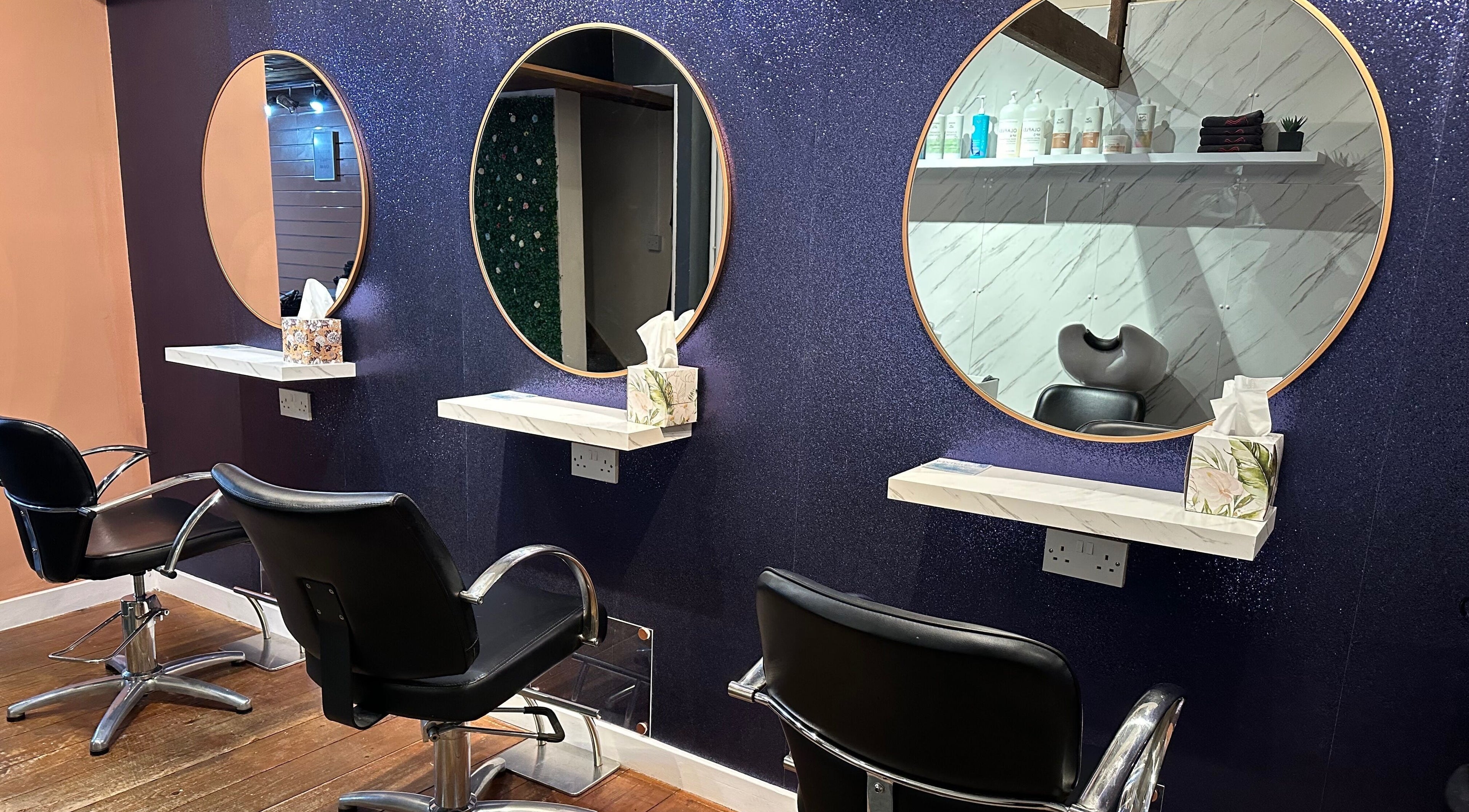 Stylish salon chairs and mirrors at Smith and Co Hair and Beauty Ltd, Canterbury, England, GB.