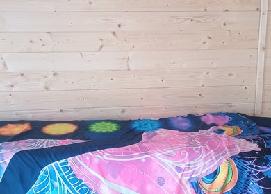 Chakra-themed bed in Kent Professional Makeup and Therapies, Ryarsh, England, GB for relaxation and therapy.
