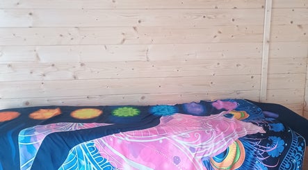 Chakra-themed bed in Kent Professional Makeup and Therapies, Ryarsh, England, GB for relaxation and therapy.