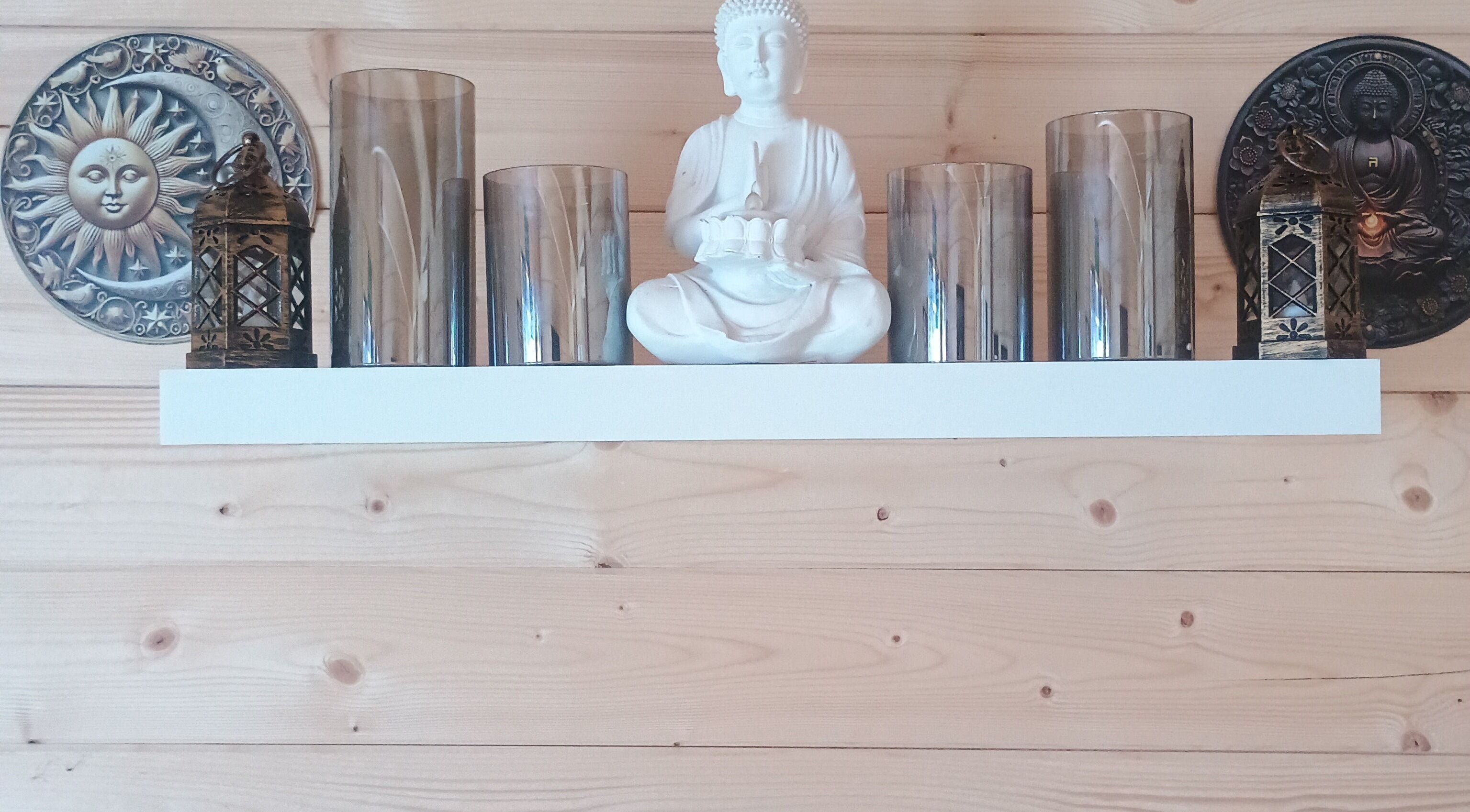 Buddha statue and decor on shelf at Kent Professional Makeup and Therapies, Ryarsh, England, GB.