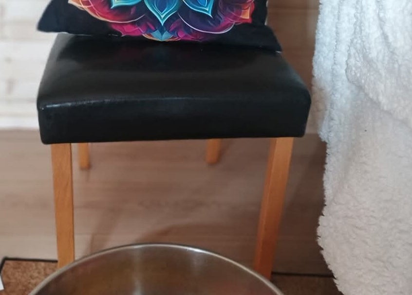 Relaxing seating area with vibrant pillow at Kent Professional Makeup and Therapies, Ryarsh, England, GB.