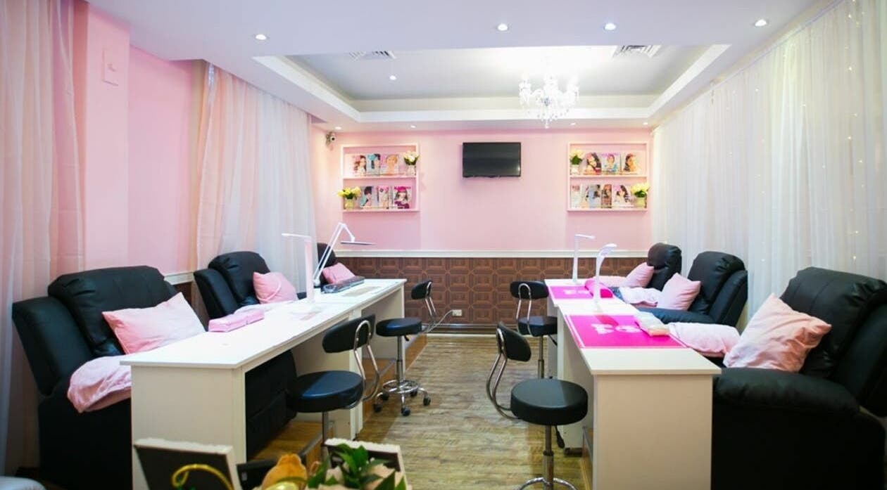 Relax in the stylish lounge at Mollyfuns Salon and Desserts, Melbourne, Victoria, AU, with cozy seating and decor.