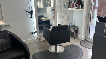 Modern salon chair and styling setup at Shellee at Salon 31, Hempstead, England, GB.