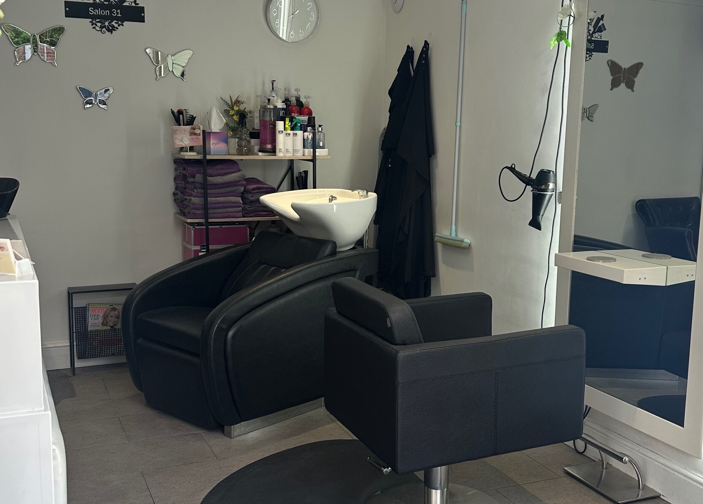 Sophisticated interior of Shellee at Salon 31, Hempstead, England, GB with modern chairs and stylish decor.