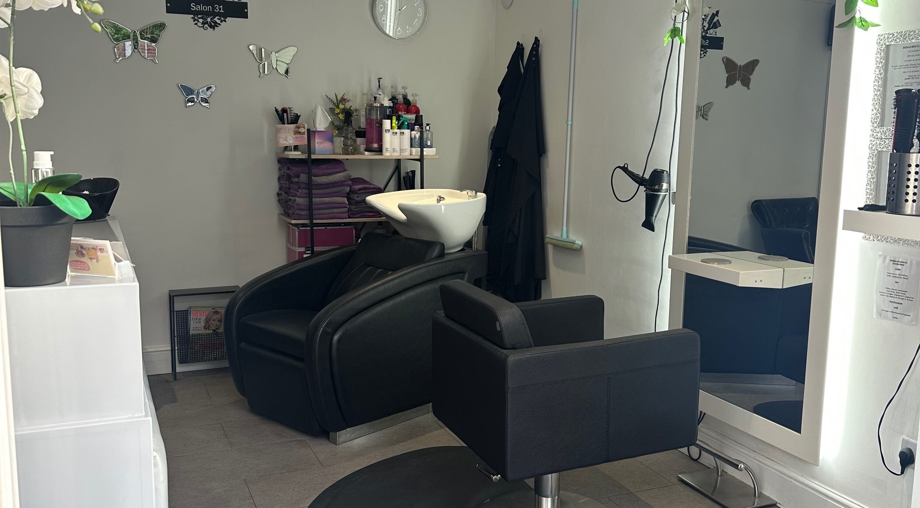 Sophisticated interior of Shellee at Salon 31, Hempstead, England, GB with modern chairs and stylish decor.