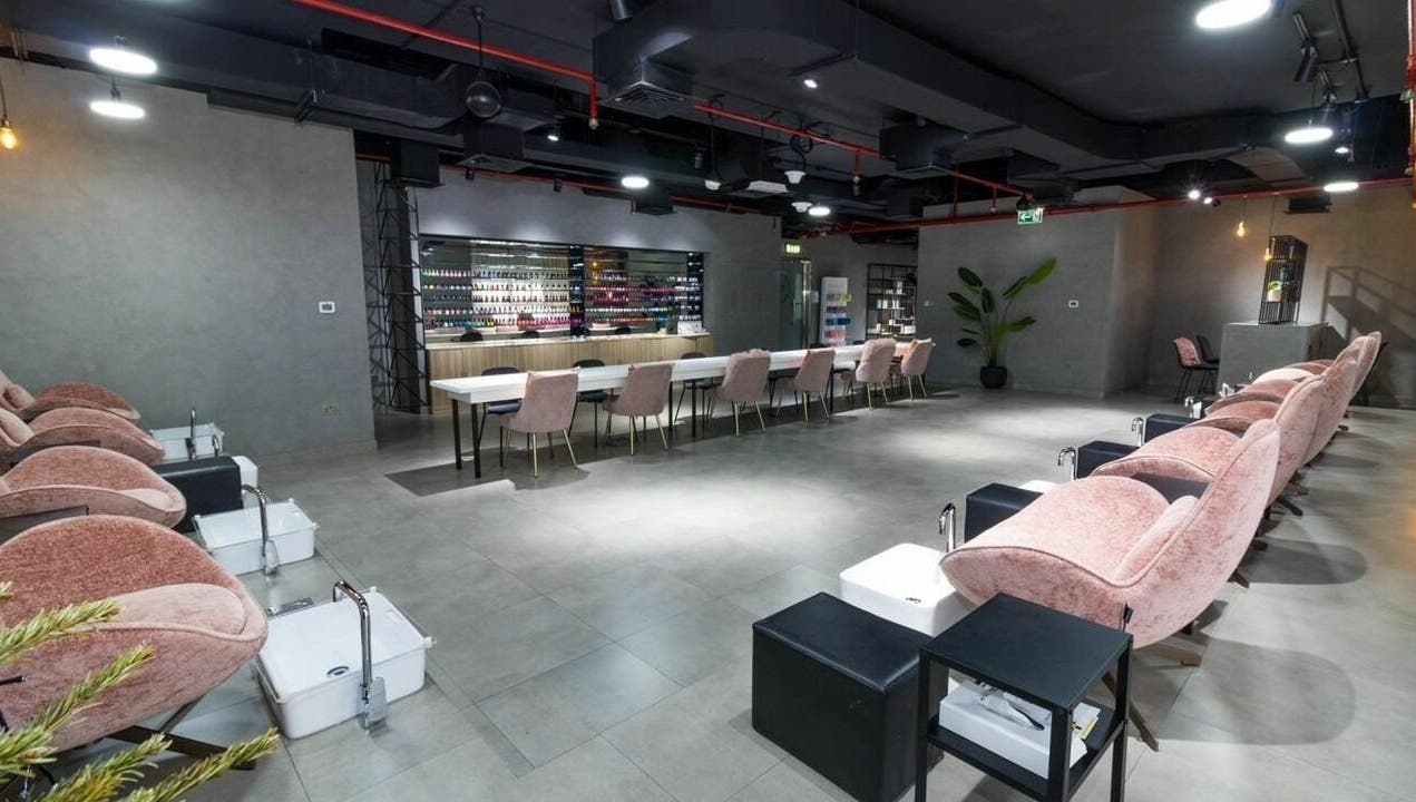 Luxurious seating and nail polish display at Painted Nails Centre LLC, Abu Dhabi, Abu Dhabi, AE.