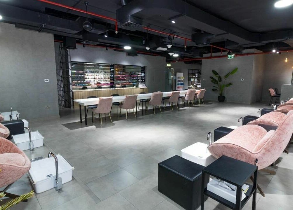 Luxurious seating and nail polish display at Painted Nails Centre LLC, Abu Dhabi, Abu Dhabi, AE.