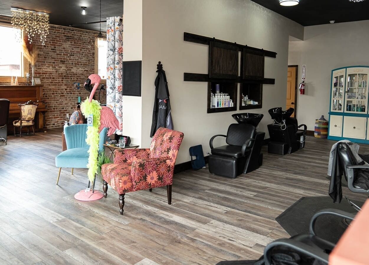 Elegant salon interior at In the Spalight in Dickson, Tennessee, US showcasing stylish seating and decor.
