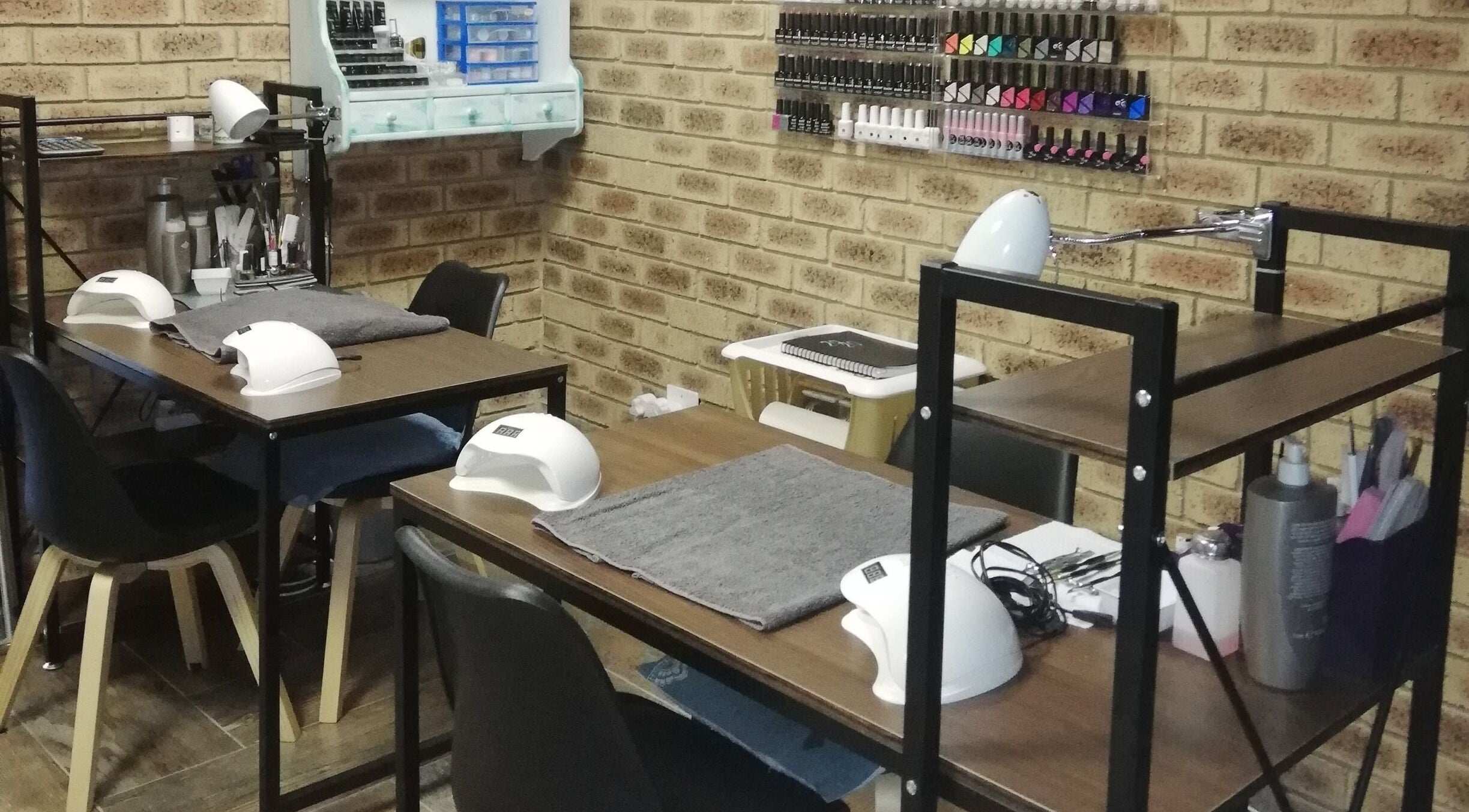 Cozy nail stations at Bonito Nail Hair Beauty Salon in Sasolburg, Free State, ZA, showcasing modern equipment.