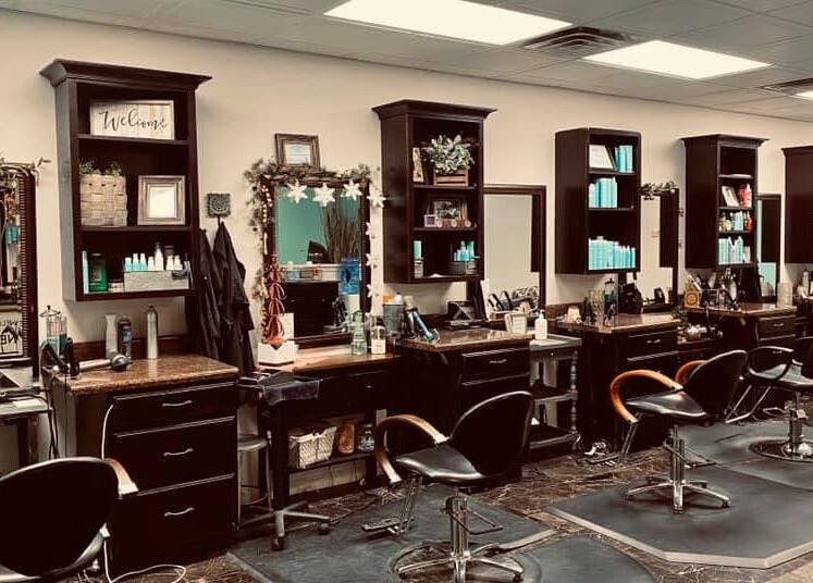 Stylish interior of Rapha Holistic Well Spa, LLC in Clarksville, Tennessee, US showcasing modern salon stations.