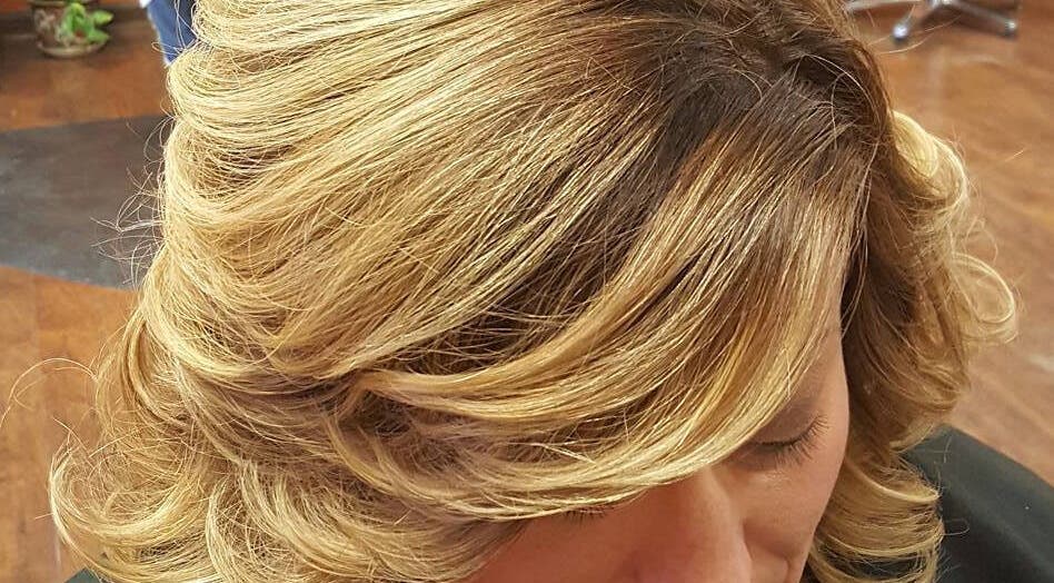 Styled golden hair at Rapha Holistic Well Spa, LLC, Clarksville, Tennessee, US.
